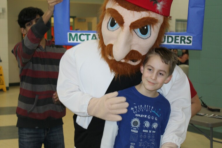 school mascot with child
